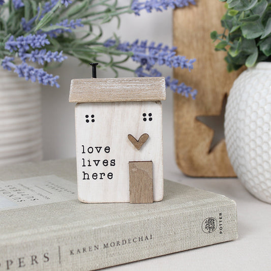 'LOVE LIVES HERE' WOODEN HOUSE